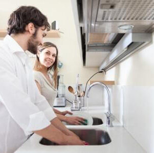 Young couple doing dishes