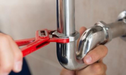 Plumber Fixing Pipe